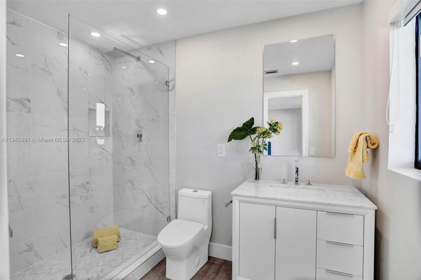 Bathroom, Glass Shower, Interior, Marble Walls, Recessed Lighting, Wood Texture Flooring