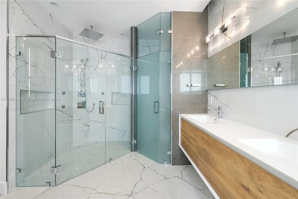 Bathroom, Dual Sink Vanities, Glass Shower, Interior, Marble, Marble Walls, Recessed Lighting
