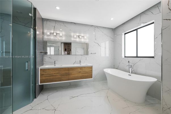 Bathroom, Dual Sink Vanities, Free Standing Baths, Glass Shower, Interior, Marble, Marble Walls, Recessed Lighting