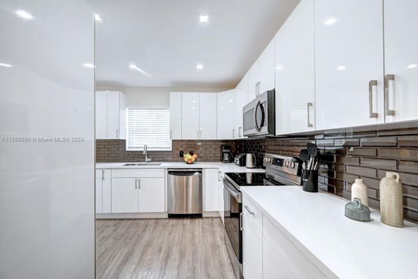 Interior, Kitchen, Recessed Lighting, Stainless Steel Appliances, Wood Texture Flooring