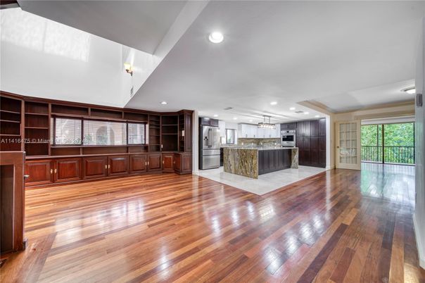 Empty room, Interior, Kitchen, Pendant Lights, Recessed Lighting, Stainless Steel Appliances, Wood Texture Flooring