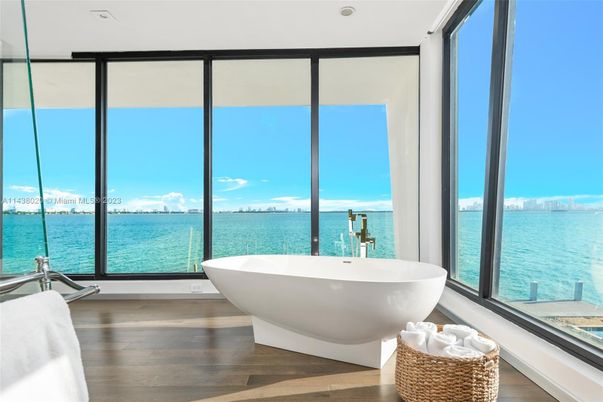 Bathroom, Free Standing Baths, Interior, Recessed Lighting, Water, Wood Texture Flooring
