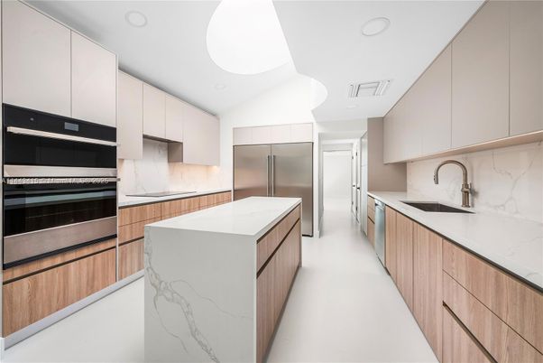 Interior, Kitchen, Marble Walls, Recessed Lighting, Stainless Steel Appliances