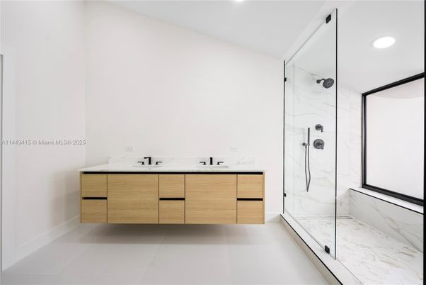 Bathroom, Dual Sink Vanities, Glass Shower, Interior, Marble Walls, Recessed Lighting