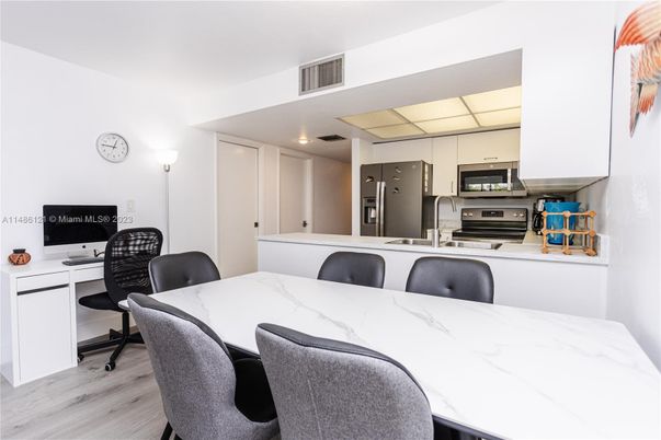 Dining room, Interior, Kitchen, Recessed Lighting, Stainless Steel Appliances, Wood Texture Flooring