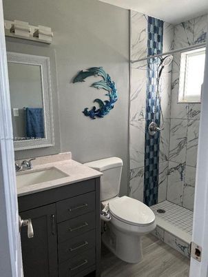 Bathroom, Glass Shower, Interior, Marble Walls, Wood Texture Flooring