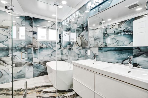 Bathroom, Dual Sink Vanities, Free Standing Baths, Glass Shower, Interior, Marble Walls, Recessed Lighting