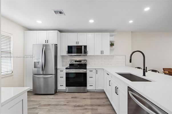 Interior, Kitchen, Recessed Lighting, Stainless Steel Appliances, Wood Texture Flooring