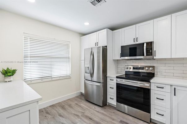 Interior, Kitchen, Recessed Lighting, Stainless Steel Appliances, Wood Texture Flooring