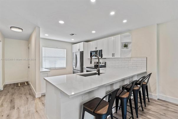 Interior, Kitchen, Recessed Lighting, Stainless Steel Appliances, Wood Texture Flooring