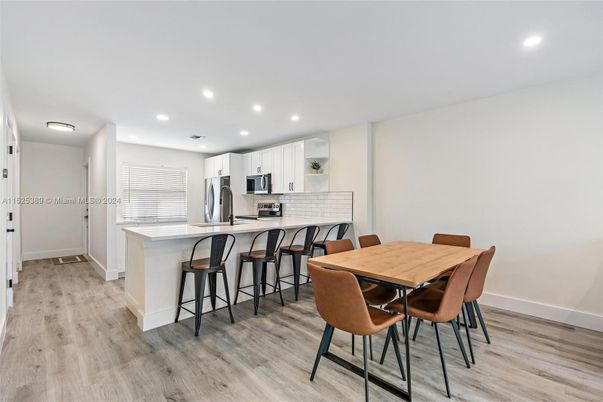 Dining room, Interior, Kitchen, Recessed Lighting, Stainless Steel Appliances, Wood Texture Flooring