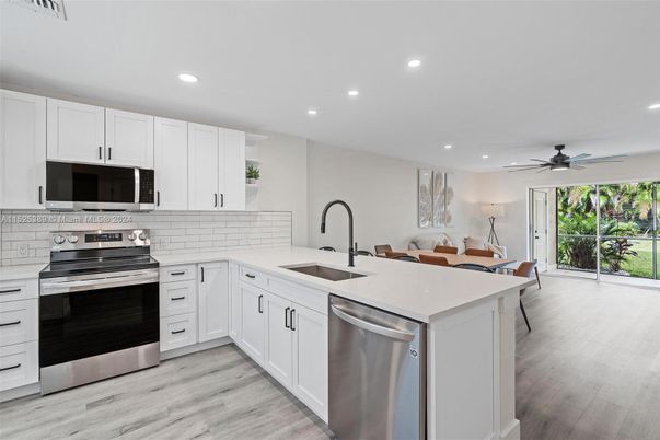 Dining room, Interior, Kitchen, Recessed Lighting, Stainless Steel Appliances, Wood Texture Flooring