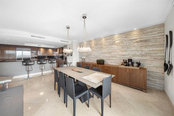 Chandelier, Dining room, Interior, Kitchen, Pendant Lights, Recessed Lighting, Stainless Steel Appliances, Stone Walls