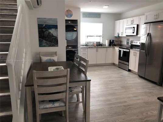 Dining room, Interior, Kitchen, Recessed Lighting, Stainless Steel Appliances, Wood Texture Flooring