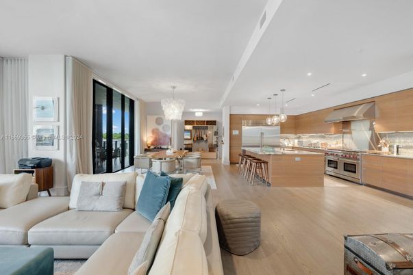 Chandelier, Dining room, Interior, Kitchen, Living room, Pendant Lights, Recessed Lighting, Stainless Steel Appliances, Wood Texture Flooring
