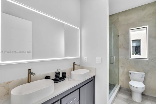 Bathroom, Dual Sink Vanities, Glass Shower, Interior, Wood Texture Flooring