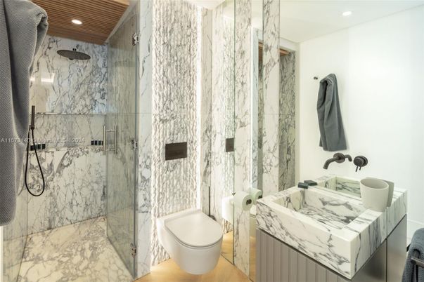 Bathroom, Glass Shower, Interior, Marble Walls, Recessed Lighting, Wood Texture Flooring