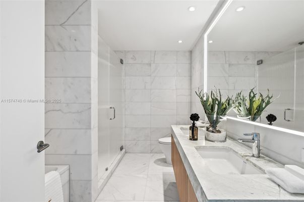 Bathroom, Dual Sink Vanities, Glass Shower, Interior, Marble, Marble Walls, Recessed Lighting