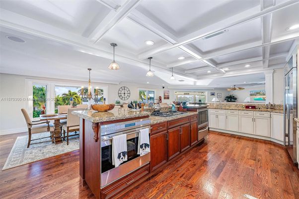 Dining room, Interior, Kitchen, Pendant Lights, Recessed Lighting, Stainless Steel Appliances, Wood Texture Flooring
