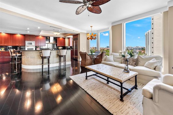 Chandelier, Dining room, Interior, Kitchen, Living room, Pendant Lights, Recessed Lighting, Stainless Steel Appliances, Wood Texture Flooring