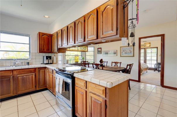 Dining room, Interior, Kitchen, Pendant Lights, Recessed Lighting, Tile Countertops