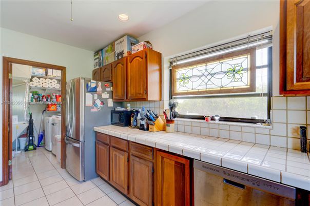 Interior, Kitchen, Recessed Lighting, Tile Countertops, Washer