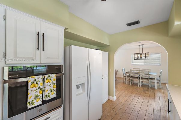 Dining room, Interior, Kitchen, Pendant Lights, Stainless Steel Appliances, Wood Texture Flooring