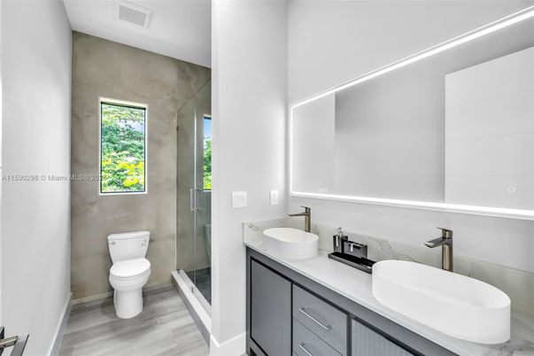 Bathroom, Dual Sink Vanities, Glass Shower, Interior, Wood Texture Flooring