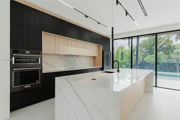 Interior, Kitchen, Marble Walls, Recessed Lighting, Stainless Steel Appliances