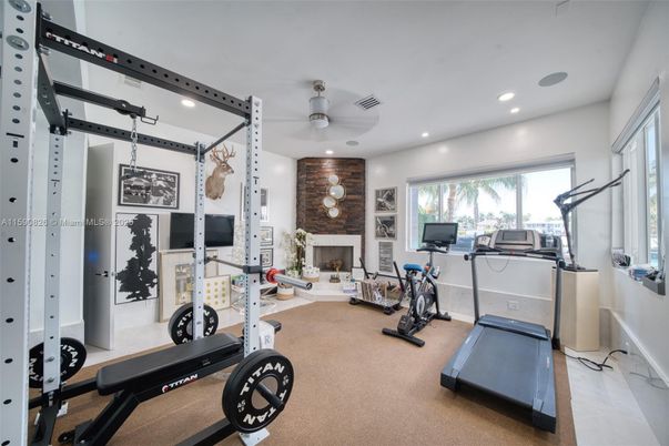 Fireplace, Fitness Equipment, Gym, Interior, Recessed Lighting, Stone Walls