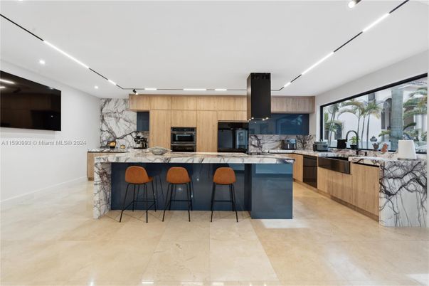 Interior, Kitchen, Marble Walls, Recessed Lighting, Stainless Steel Appliances