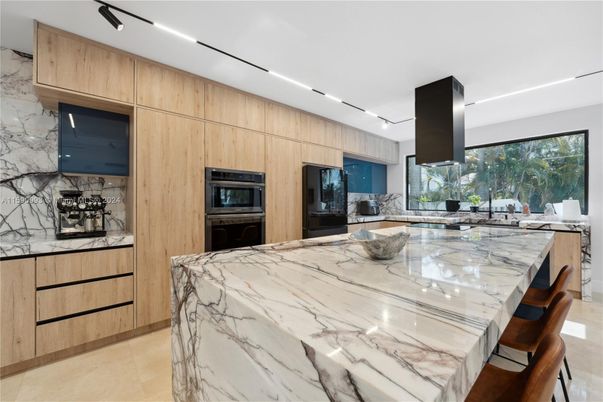 Interior, Kitchen, Marble Walls, Recessed Lighting, Stainless Steel Appliances