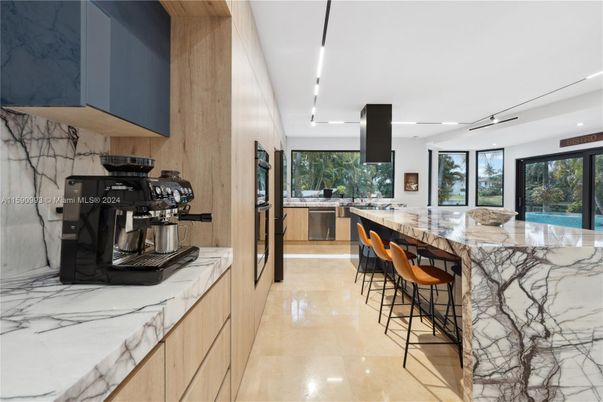 Interior, Kitchen, Marble Walls, Recessed Lighting, Stainless Steel Appliances