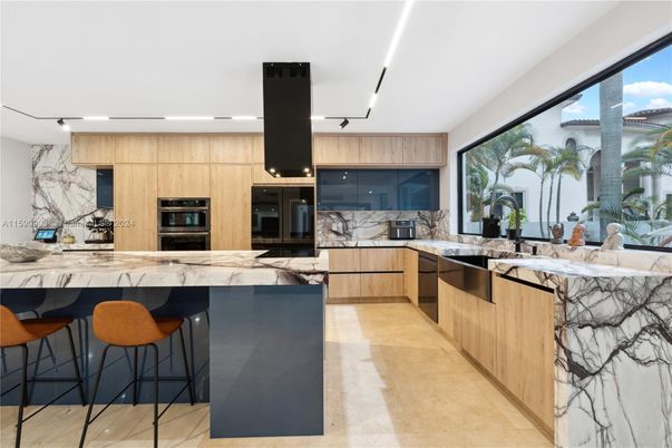 Interior, Kitchen, Marble Walls, Recessed Lighting, Stainless Steel Appliances