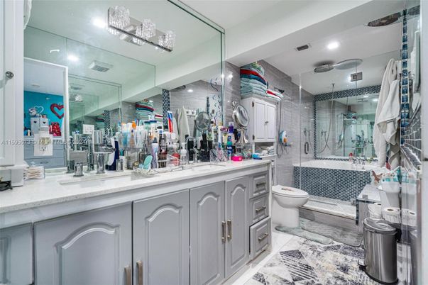 Bathroom, Dual Sink Vanities, Glass Shower, Interior, Marble, Recessed Lighting