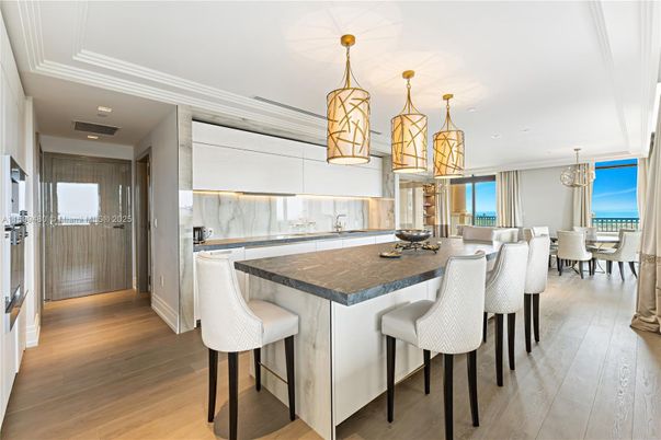 Chandelier, Dining room, Interior, Kitchen, Pendant Lights, Recessed Lighting, Stainless Steel Appliances, Wood Texture Flooring