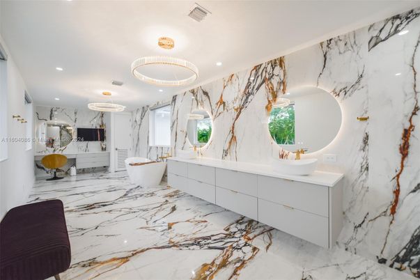 Bathroom, Dual Sink Vanities, Free Standing Baths, Interior, Marble, Marble Walls, Pendant Lights, Recessed Lighting