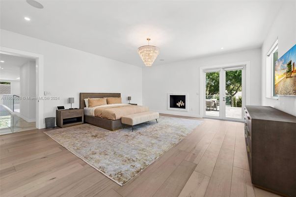 Bedroom, Chandelier, Fireplace, Interior, Recessed Lighting, Wood Texture Flooring