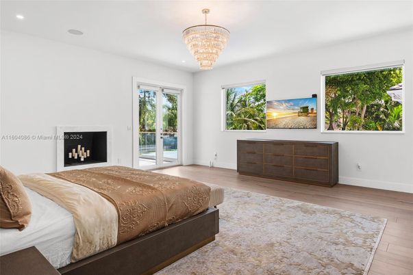 Bedroom, Chandelier, Fireplace, Interior, Recessed Lighting, Wood Texture Flooring