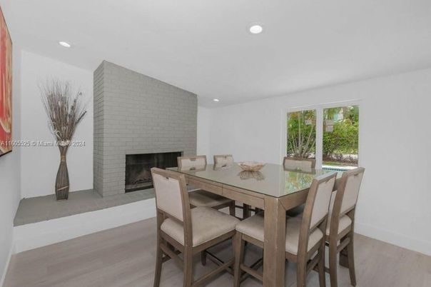 Dining room, Fireplace, Interior, Recessed Lighting, Stone Walls, Wood Texture Flooring