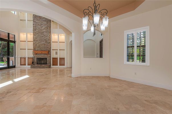 Chandelier, Empty room, Fireplace, Interior, Pendant Lights, Stone Walls