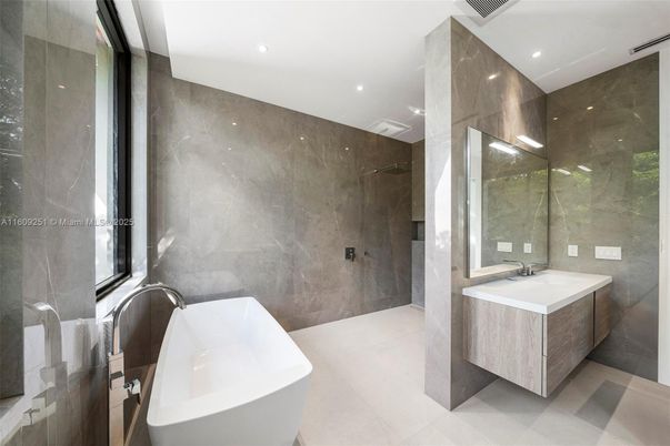 Bathroom, Dual Sink Vanities, Free Standing Baths, Glass Shower, Interior, Marble Walls, Recessed Lighting