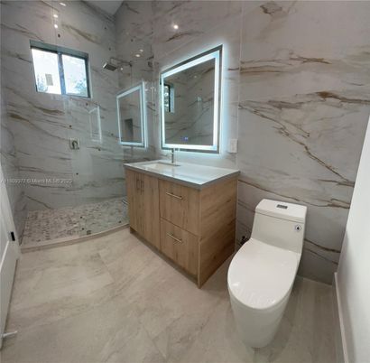 Bathroom, Dual Sink Vanities, Glass Shower, Interior, Marble Walls, Recessed Lighting