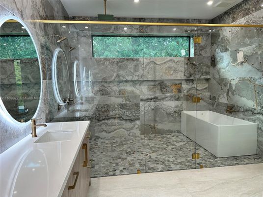 Bathroom, Free Standing Baths, Glass Shower, Interior, Marble, Marble Walls, Recessed Lighting