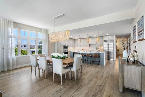 Chandelier, Dining room, Interior, Kitchen, Pendant Lights, Recessed Lighting, Stainless Steel Appliances, Wood Texture Flooring