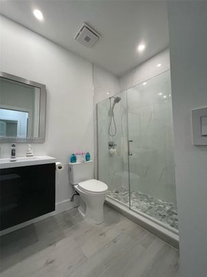 Bathroom, Glass Shower, Interior, Marble Walls, Recessed Lighting, Wood Texture Flooring
