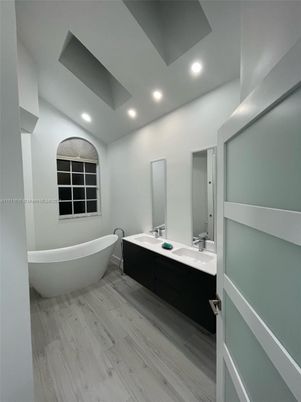 Bathroom, Dual Sink Vanities, Free Standing Baths, Interior, Recessed Lighting, Wood Texture Flooring