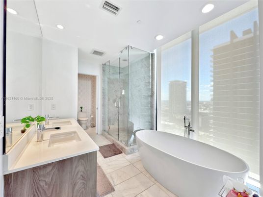 Bathroom, Free Standing Baths, Glass Shower, Interior, Marble, Marble Walls, Recessed Lighting