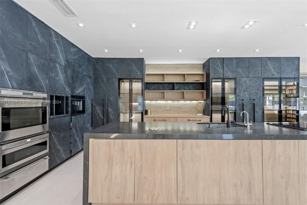 Interior, Kitchen, Marble Walls, Recessed Lighting, Stainless Steel Appliances