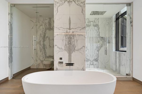 Bathroom, Free Standing Baths, Glass Shower, Interior, Marble Walls, Wood Texture Flooring